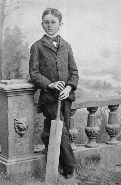 Edward Staunton posing with a cricket bat